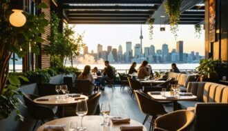 A modern outdoor dining scene in Toronto with a designated vaping area, featuring patrons enjoying meals and vaping under the Toronto skyline at sunset.